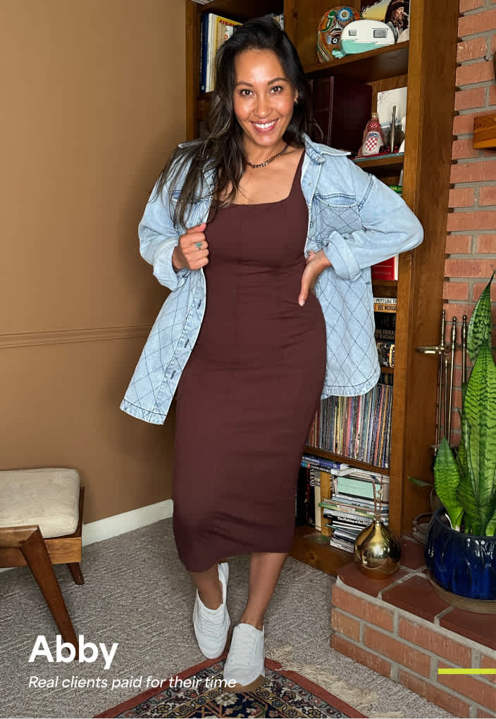 Abby: Woman in a fitted brown dress with a light denim jacket and sneakers—casual and confident outfit for women in their 30s.