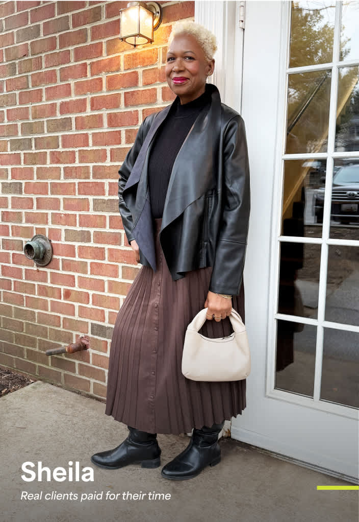 Sheila: Woman dressed in a pleated midi skirt, black turtleneck and leather jacket—elevated classic style for women in their 60s.
