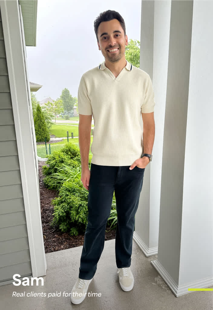 Model wearing Stitch Fix men’s clothing, including: cream knit polo, black pants, white sneakers.