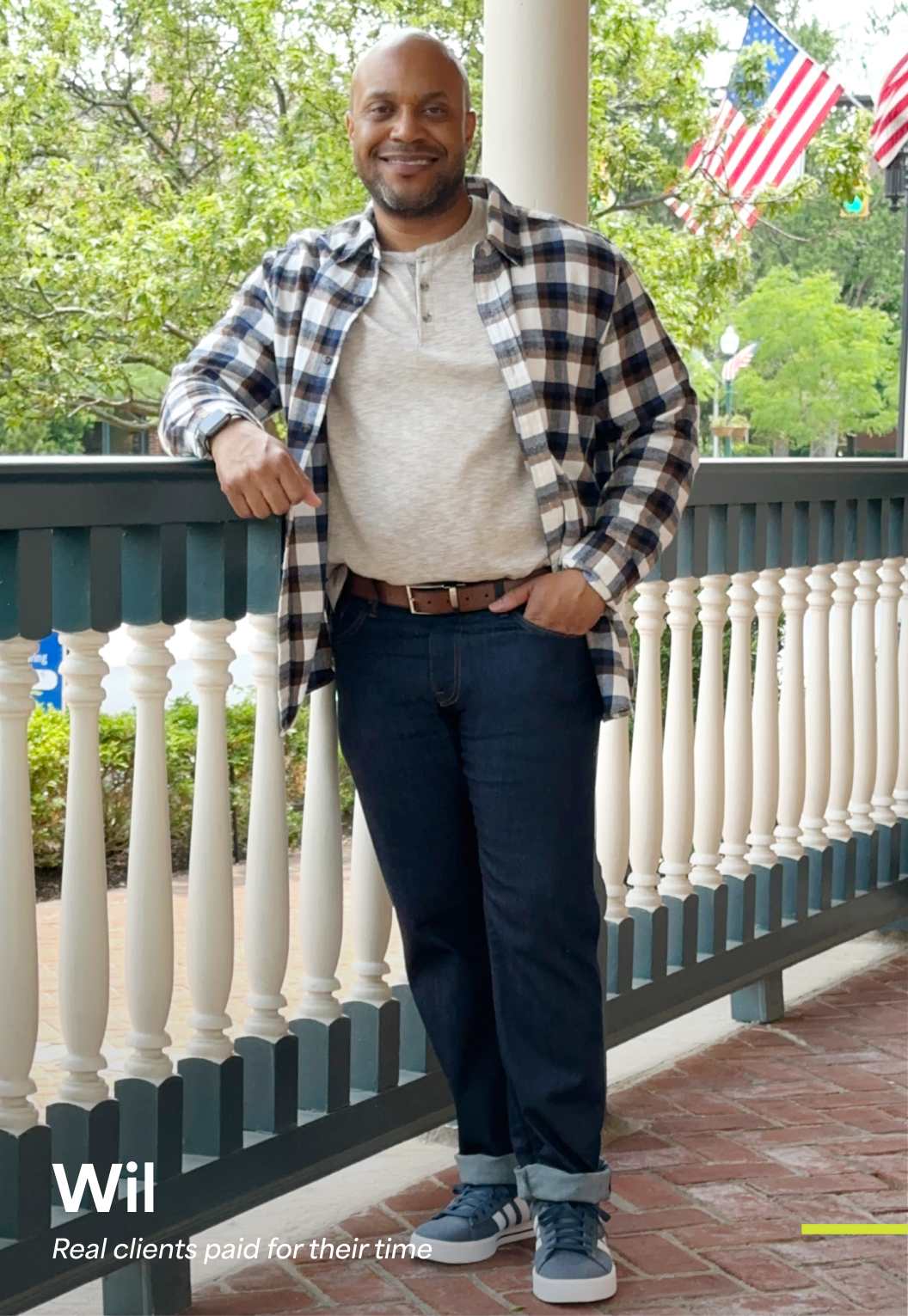 Will, a Stitch Fix men’s client, wearing a plaid overshirt, white tee, and dark jeans. 