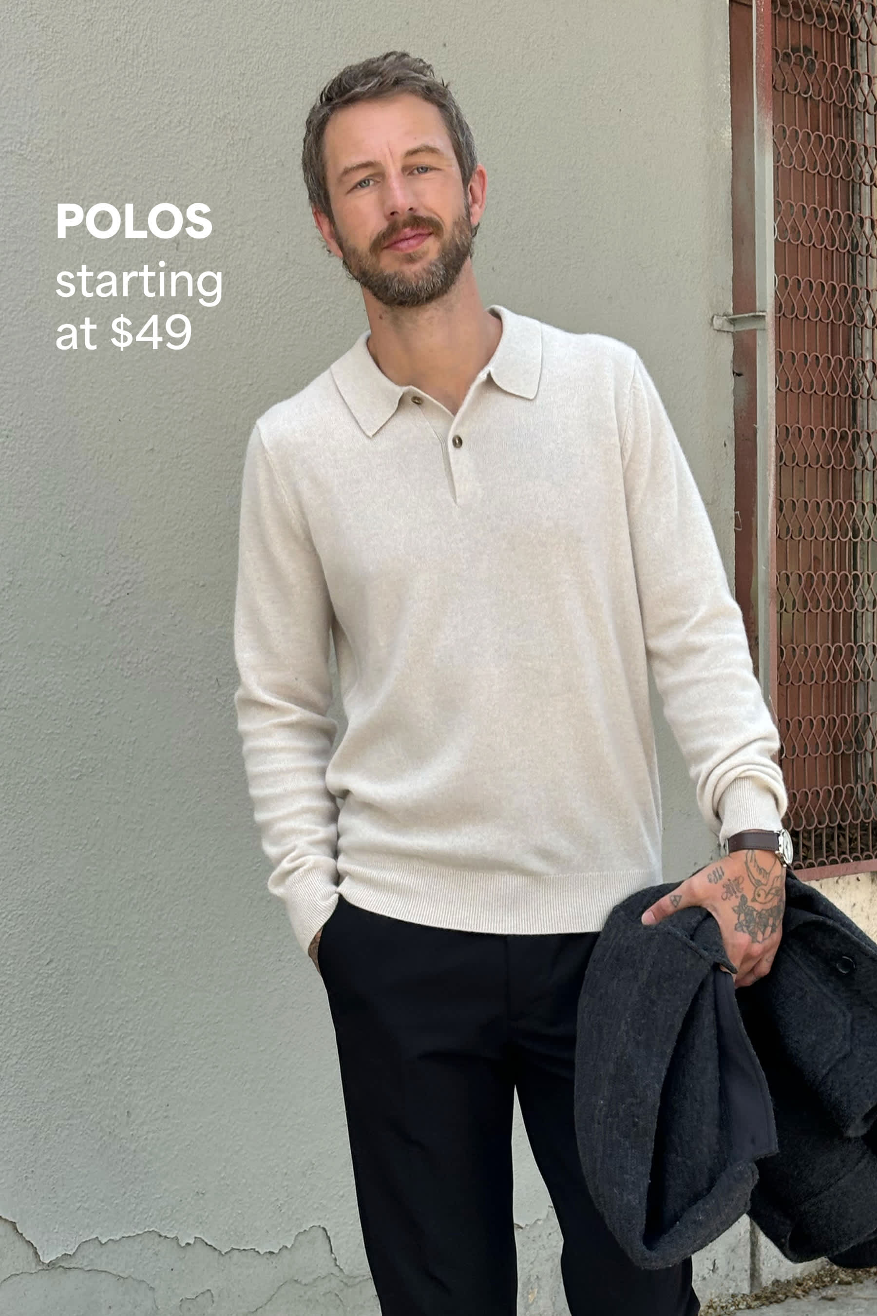 Stitch Fix men’s outfit featuring a man in a cream long-sleeve polo shirt and black trousers, holding a gray jacket. Text reads: “POLOS starting at $49.”