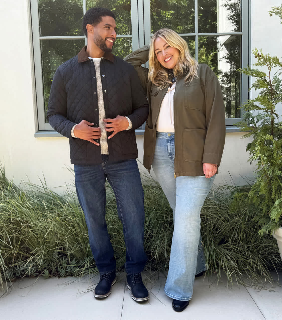 A split screen of two images—one displaying a closet rack with Stitch Fix men's and women's clothing on hangers and stacked on a shelf. Featuring items like flannels, sweaters, jeans and boots. The other of a man and woman posing happily outside in fall clothes.
