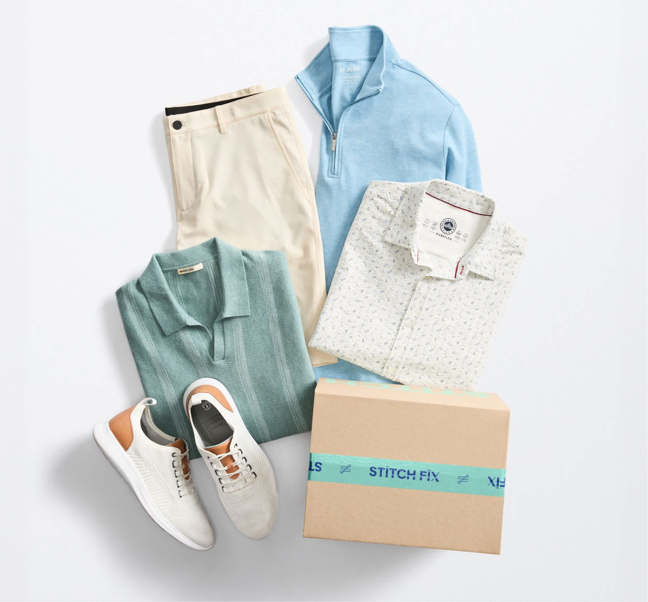 Light blue quarter-zip sweater, white patterned button-down, cream chinos, green polo, white sneakers