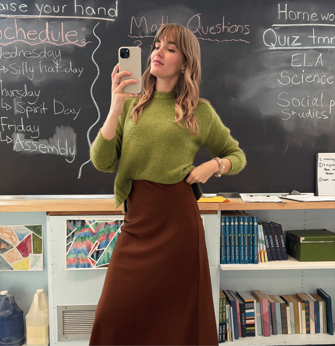 Stitch Fix hero split-screen image. One side shows a teacher taking a selfie in a classroom wearing a green sweater and brown slip skirt. The other side shows a rack shot with various items on the hangers, like blue jeans, a floral blouse and neutral cardigan.