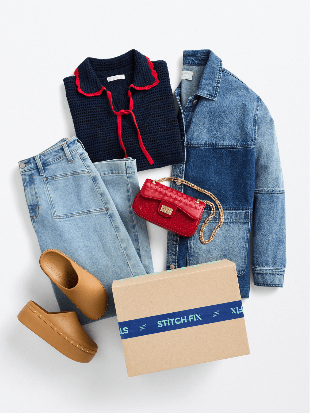 Women’s navy sweater with red trim, light jeans, denim jacket, tan clogs, red bag with Stitch Fix box