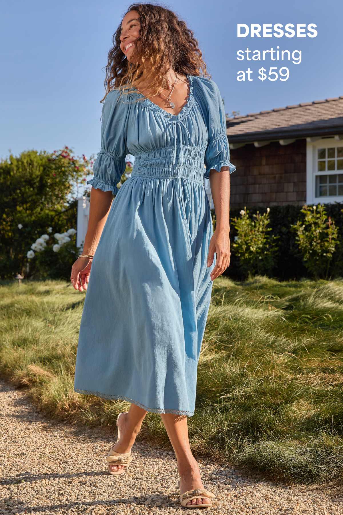 A woman models a blue midi dress outdoors beside text that reads “DRESSES starting at $59.”