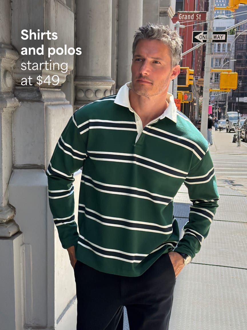 Man in green striped rugby shirt with white collar and black trousers outdoors. Text: Shirts and polos starting at $49
