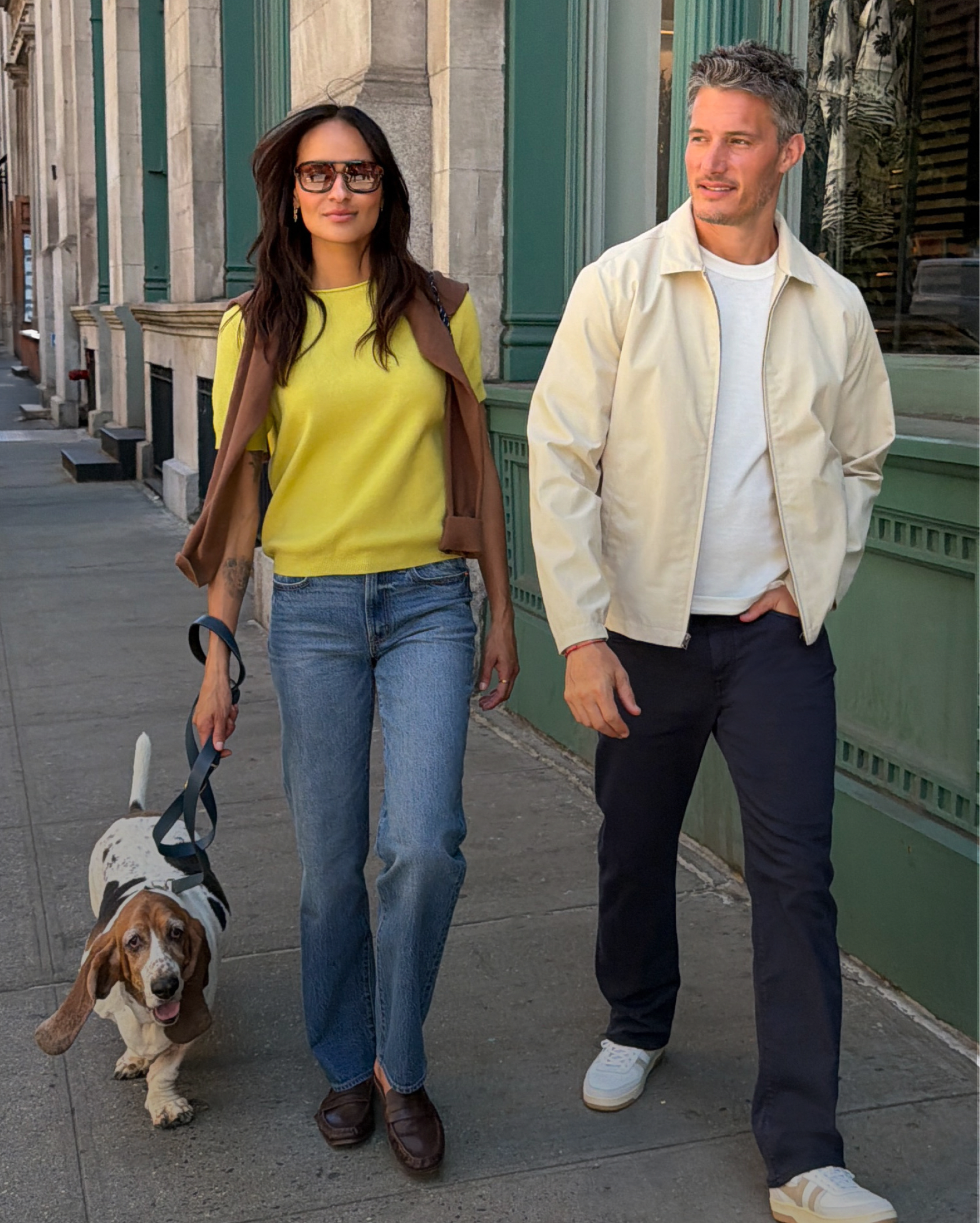 Side-by-side of a man in rust sweater sitting with a dog and a man in olive corduroy jacket holding a phone