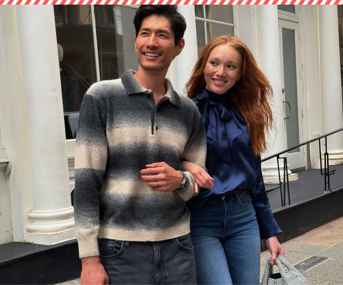 A split fashion image showing a man in a patterned sweater and a woman in a blue satin top carrying Stitch Fix gift boxes on a city street on the left, and a woman posing outdoors in a black coat and wide-leg trousers on the right.
