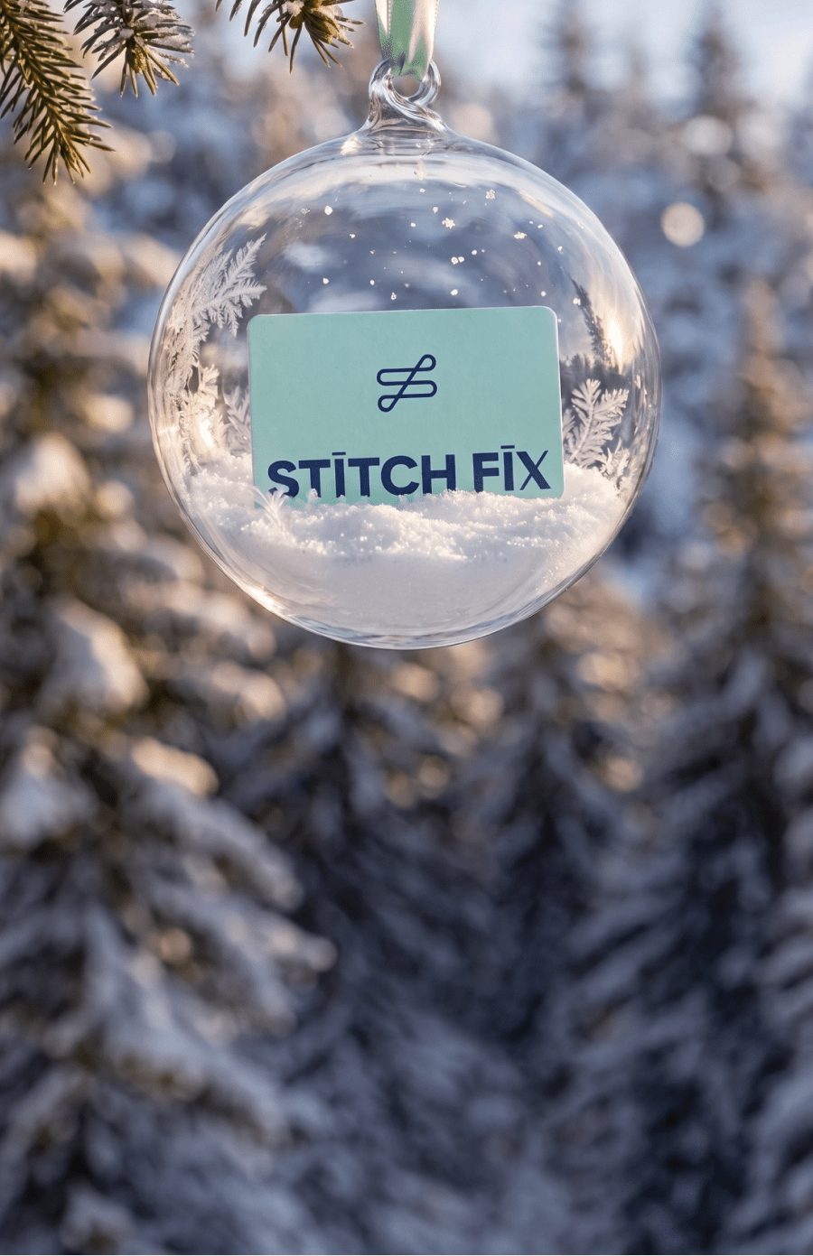 A hand holding a Stitch Fix gift card