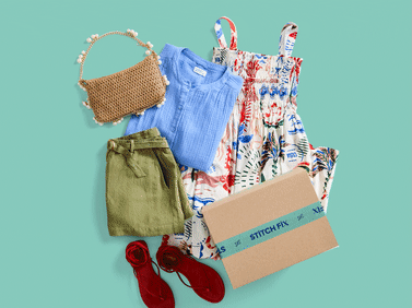 An assortment of summer clothing with Stitch Fix box, including pieces for vacation, work, and everyday.