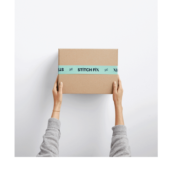Model holding Stitch Fix subscription box.