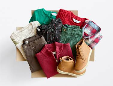 Stitch Fix kids clothes unboxing, including purple tee, pink sandals, green swim, patterned skort, denim button-down, pink shirt and shorts set.