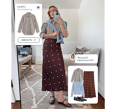 A woman models a Stitch Fix outfit in a mirror selfie, wearing a brown-and-white striped button-up shirt tucked into a chocolate brown midi skirt with white polka dots, with a light blue sweater draped over her shoulders and black mesh Mary Jane flats. Stitch Fix interface overlays show the featured Z SUPPLY Christi Button Up with an "Add to Fix" button, a message from Stylist Lainie reading "Nice pick! Here's your Fix!", and a curated outfit featuring the striped shirt, polka dot skirt, light blue long-sleeve top, and black flats.