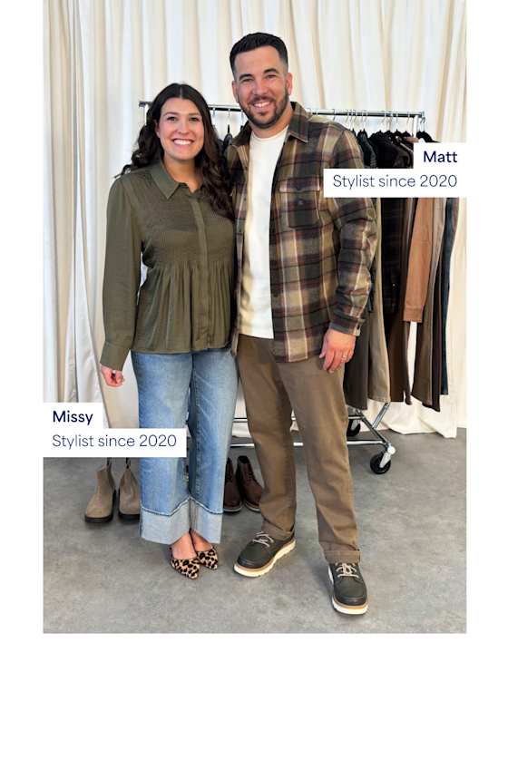 An image of two real Stitch Fix Stylists, Missy and Matt, posing in front of a clothing rack in a studio.