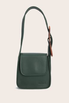 An image of Edas accessories, including a green handbag.